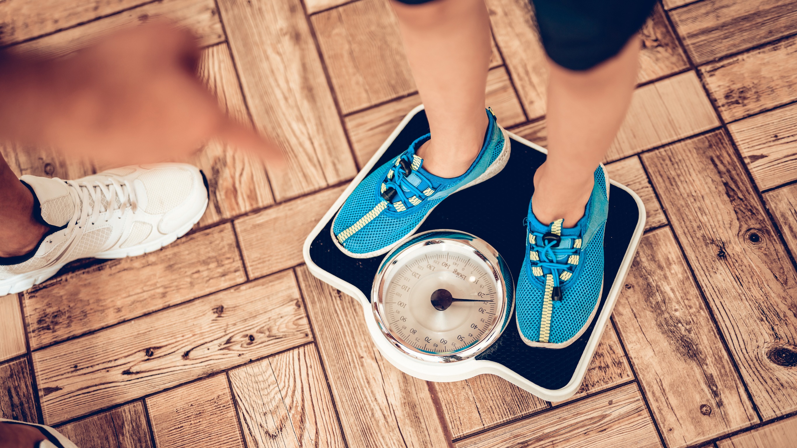 Woman standing on a smart scale