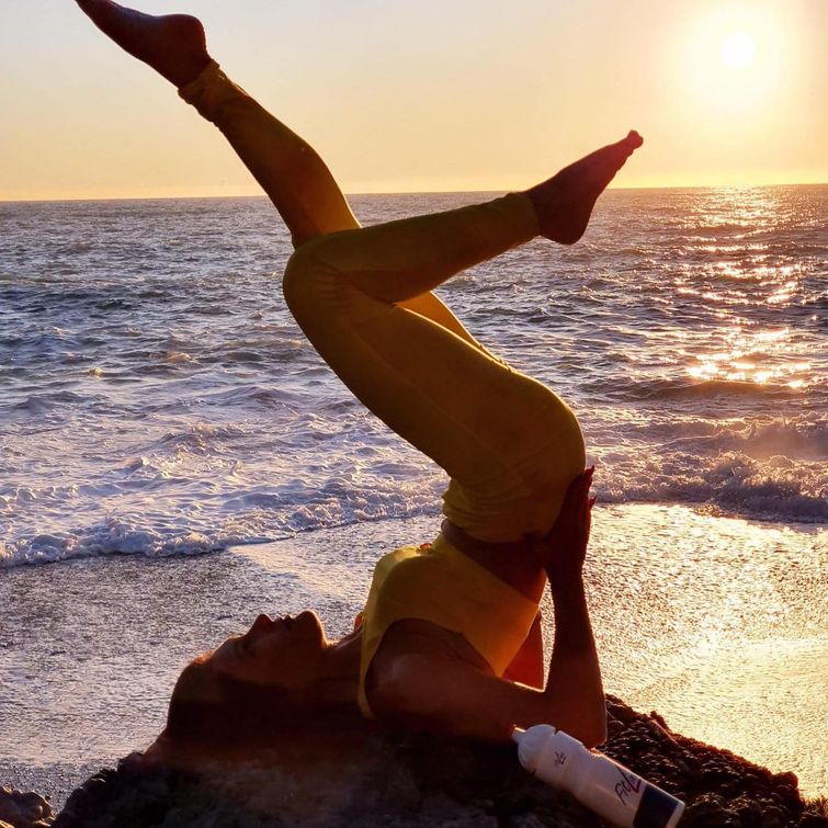 Woman full of energy at the sea
