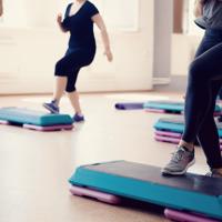 Group fitness class step workout