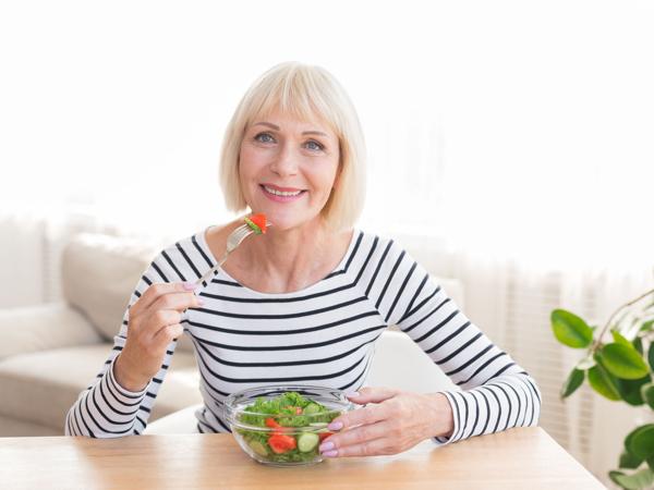 Senior Woman Eating Salad