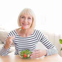 Senior Woman Eating Salad