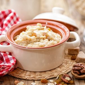 Delight in a cozy bowl of creamy oatmeal, topped with crunchy walnuts and raisins. Perfect for a comforting breakfast, it