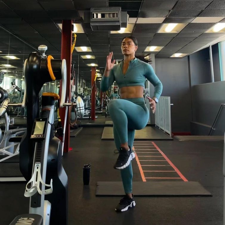 Woman demonstrating HIIT exercises