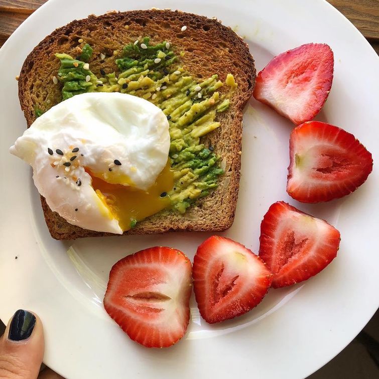 Delicious poached eggs on avocado toast