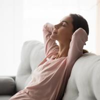Woman napping on sofa