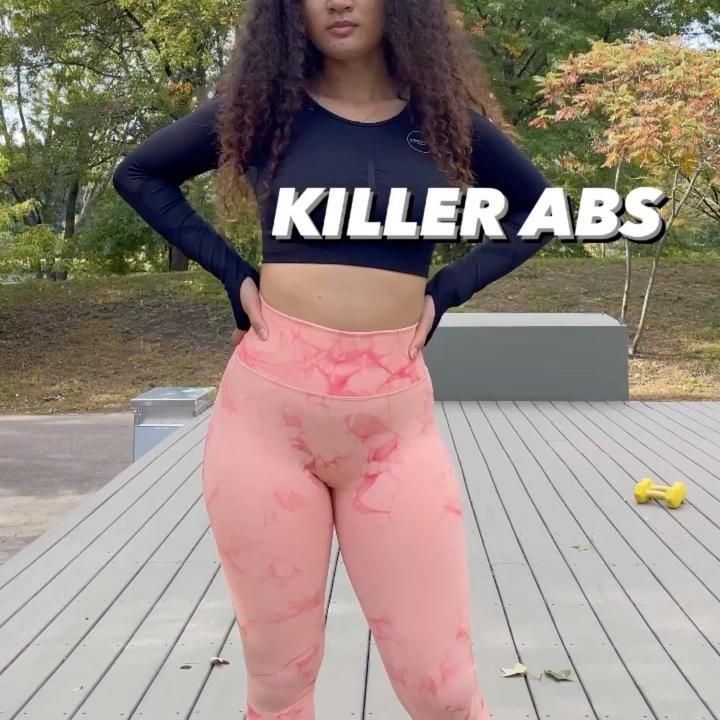 Model demonstrating ab workout with resistance bands