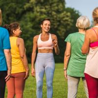 Elderly women stretching in park