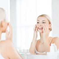 Woman applying face cream