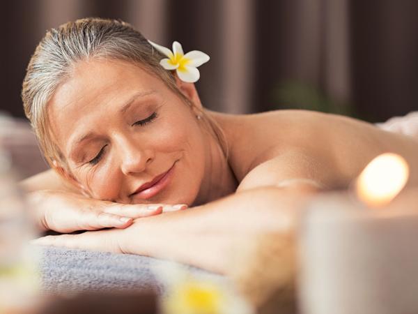 Mature woman enjoying a spa massage