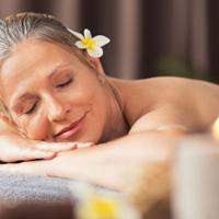 Mature woman enjoying a spa massage