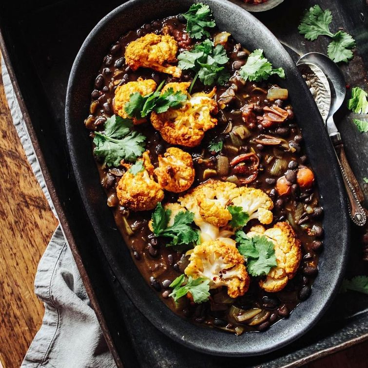 Delicious spiced black beans with golden roast turmeric cauliflower