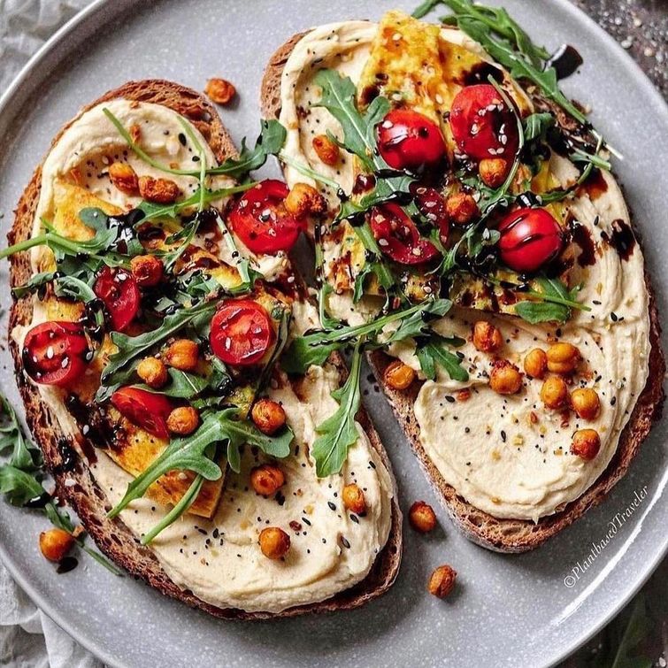 Vegan sourdough toast with hummus and spinach omelette