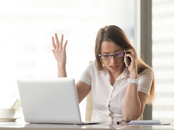 Angry businesswoman on phone