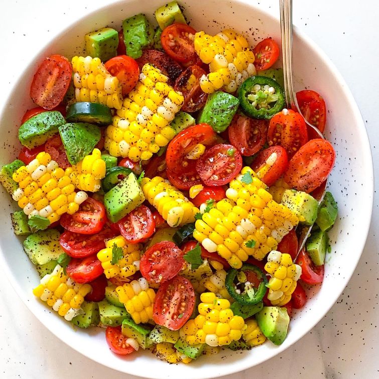 Colorful corn, tomato and avocado salad