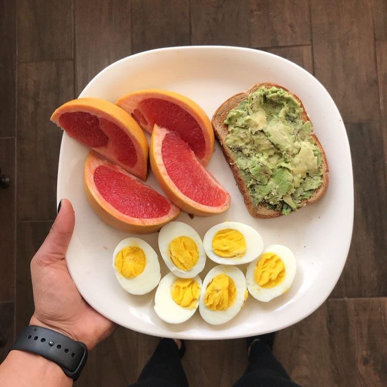 Healthy breakfast of avocado toast and boiled eggs