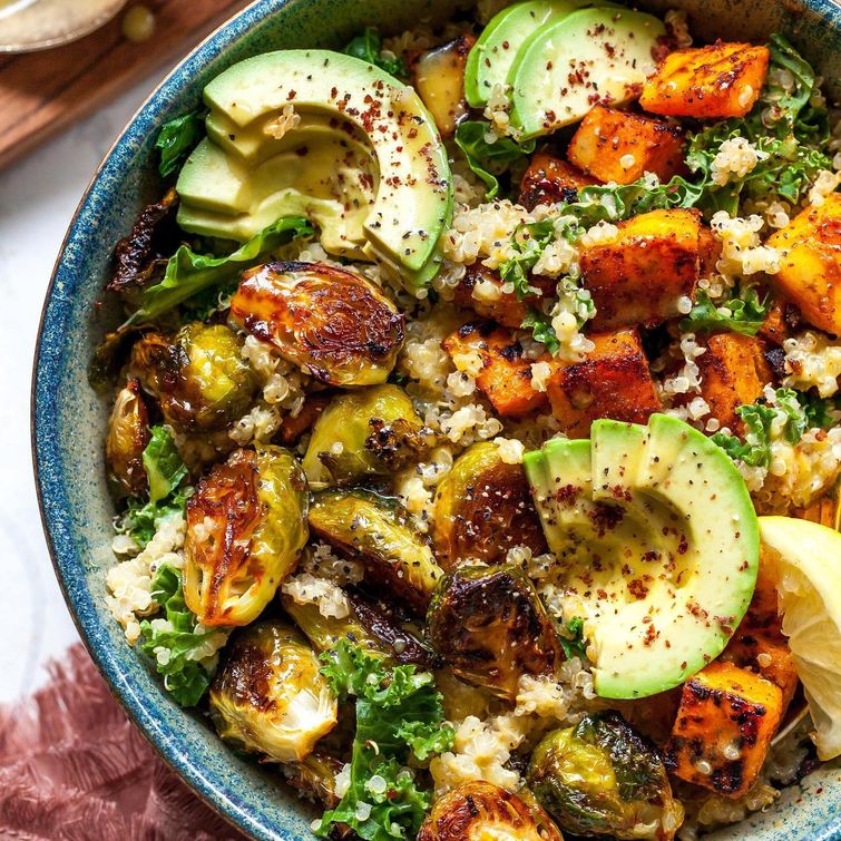 Vegan and gluten-free roasted veggie and quinoa bowl with honey-Dijon dressing