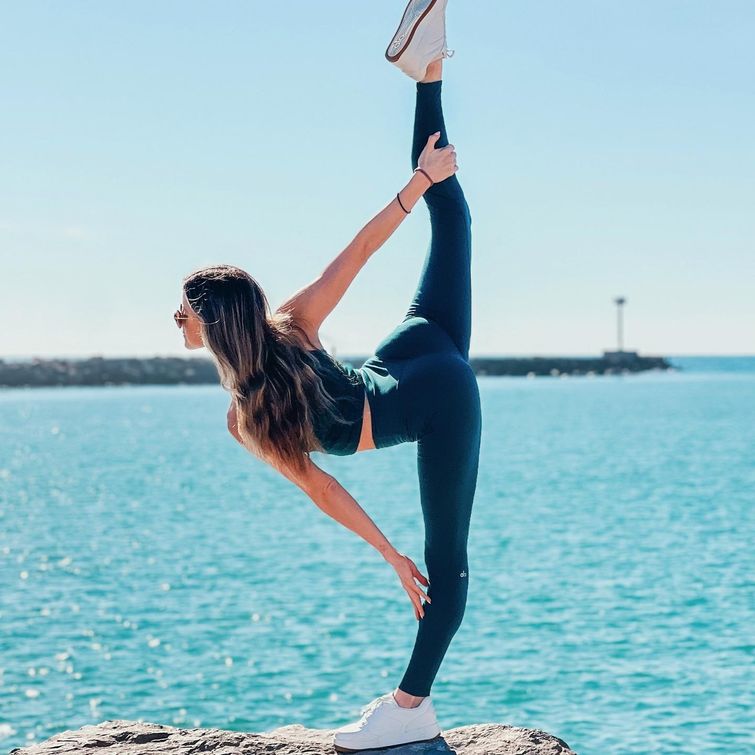 Yoga practitioner in standing split pose