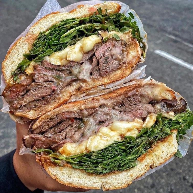 Delicious steak sandwich with brie and arugula