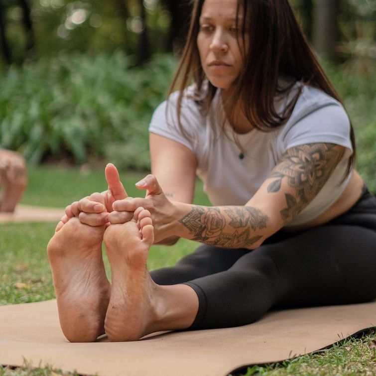 Yoga practitioner performing forward bend poses