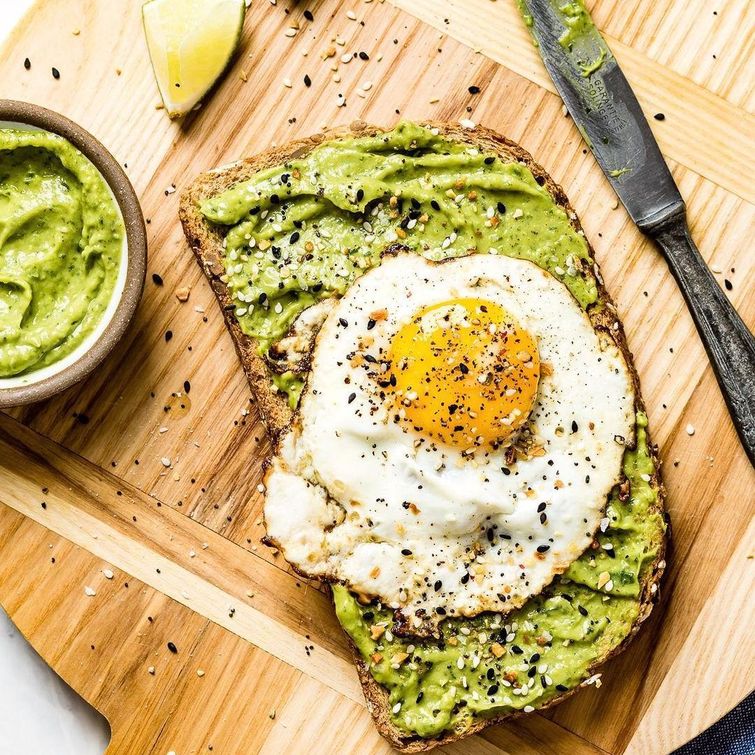 Delicious avocado toast topped with a fried egg