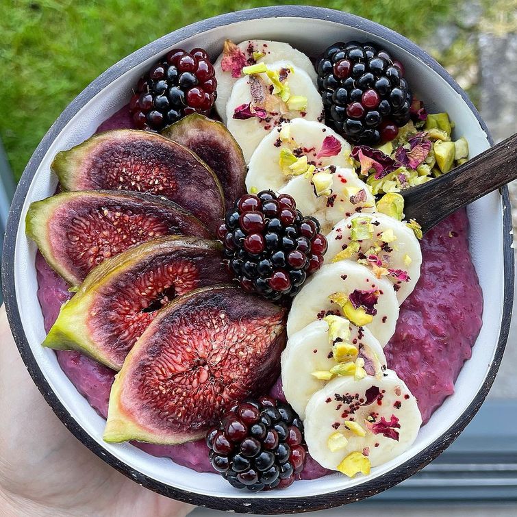 Bowl of oats with figs, blackberries, and Haskapa