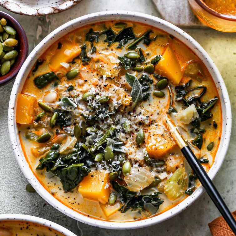 Delicious autumn soup with butternut squash, kale, and white beans