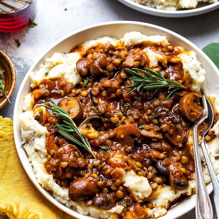 Delicious stewed mushrooms and lentils over potato-parsnip mash
